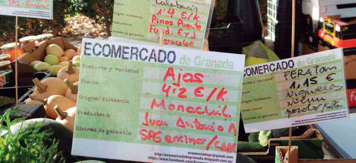 Cartelitos que muestran garantía SPG y de certificadora en un ecomercado de Granada, España. De La Cruz y otros (p. 8)